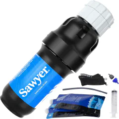 Sawyer Squeeze water filtration system hanging from a van galley cabinet with a 32oz water pouch attached